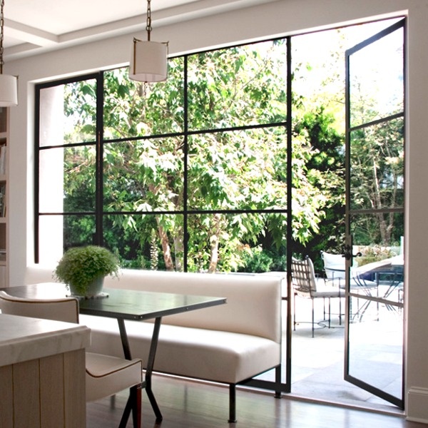 Living room steel windows and doors with backyard view panels in Los Angeles CA