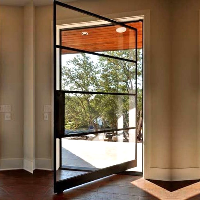 Modern custom made pivot door black framed steel
